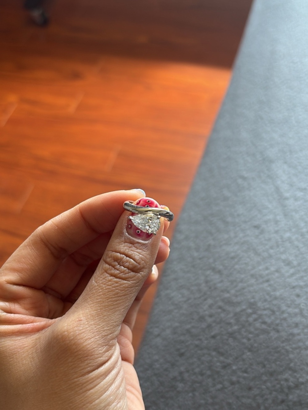 Silver Ring with Clear Center Stone and Twisted Band - Pink Accent